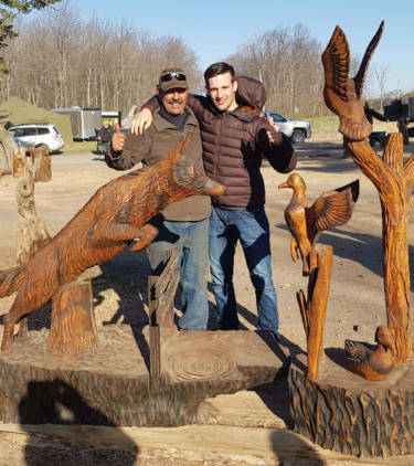 Micha and Robbin with the life-sized jumping coyote.