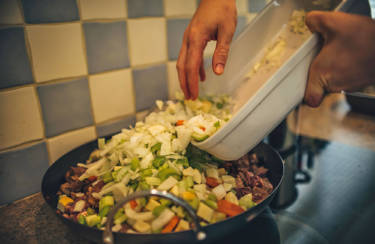 Meat and vegetables must cook for an hour before the stew is ready.